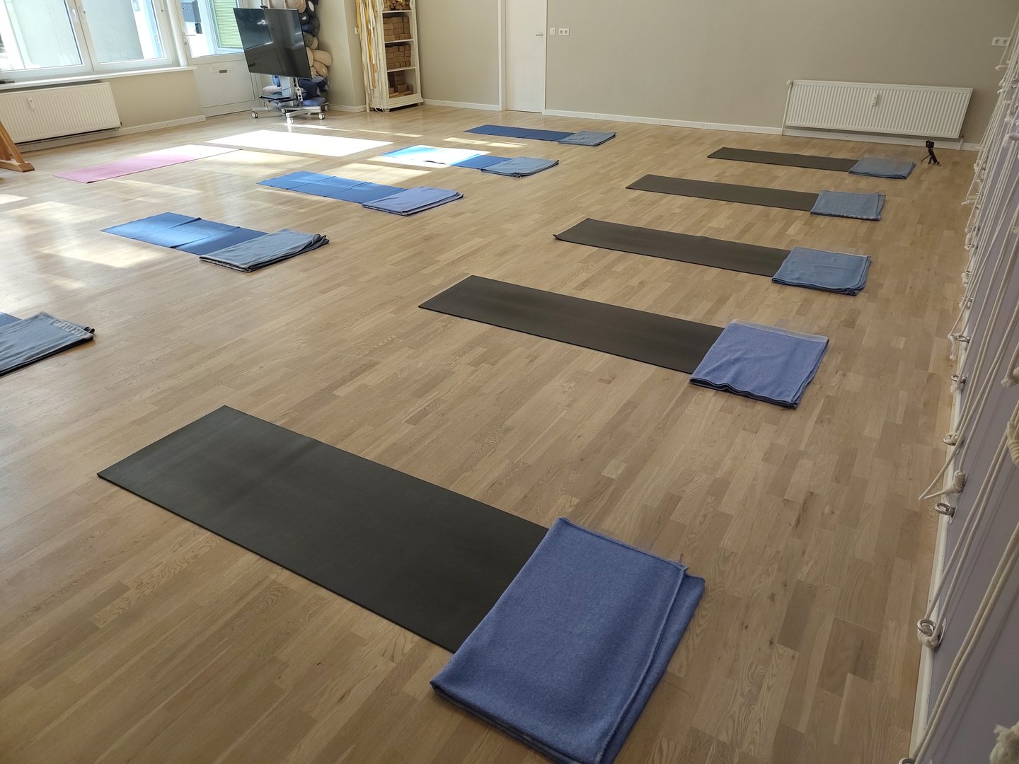 Yoga room with blankets and yoga mats laid out